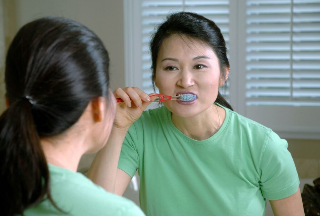 brushing teeth with baking soda