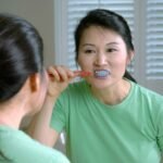 brushing teeth with baking soda